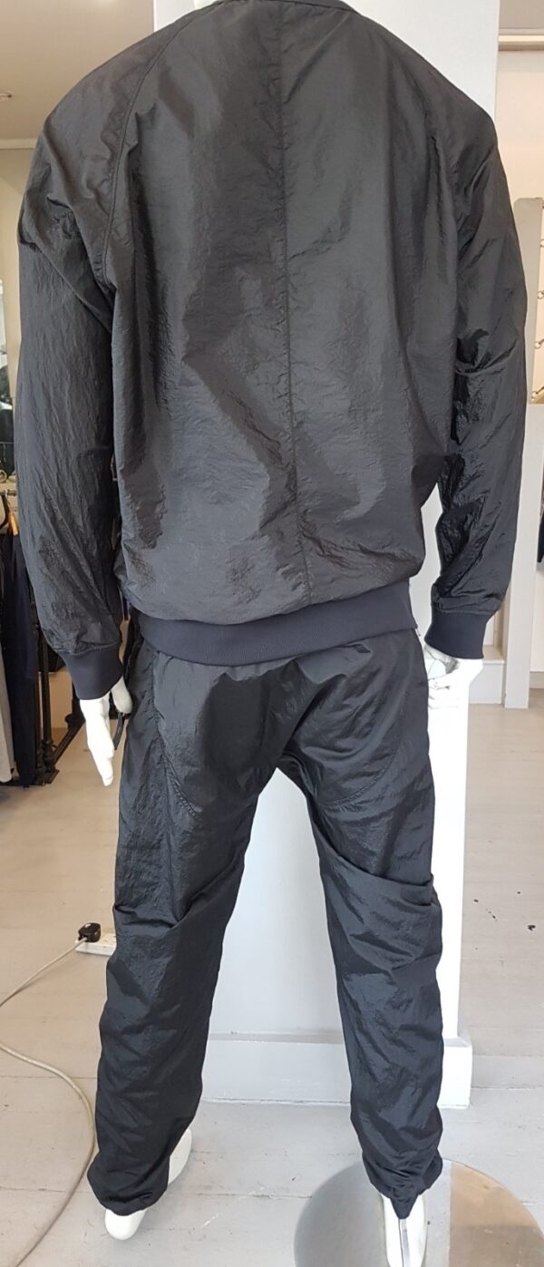 Stone Island Softshell Tracksuit in Black, a luxurious pre-loved piece.