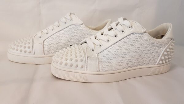 Elegant Christian Louboutin Seavaste 2 Sneakers in White, featuring spikes on toe box and heel.
