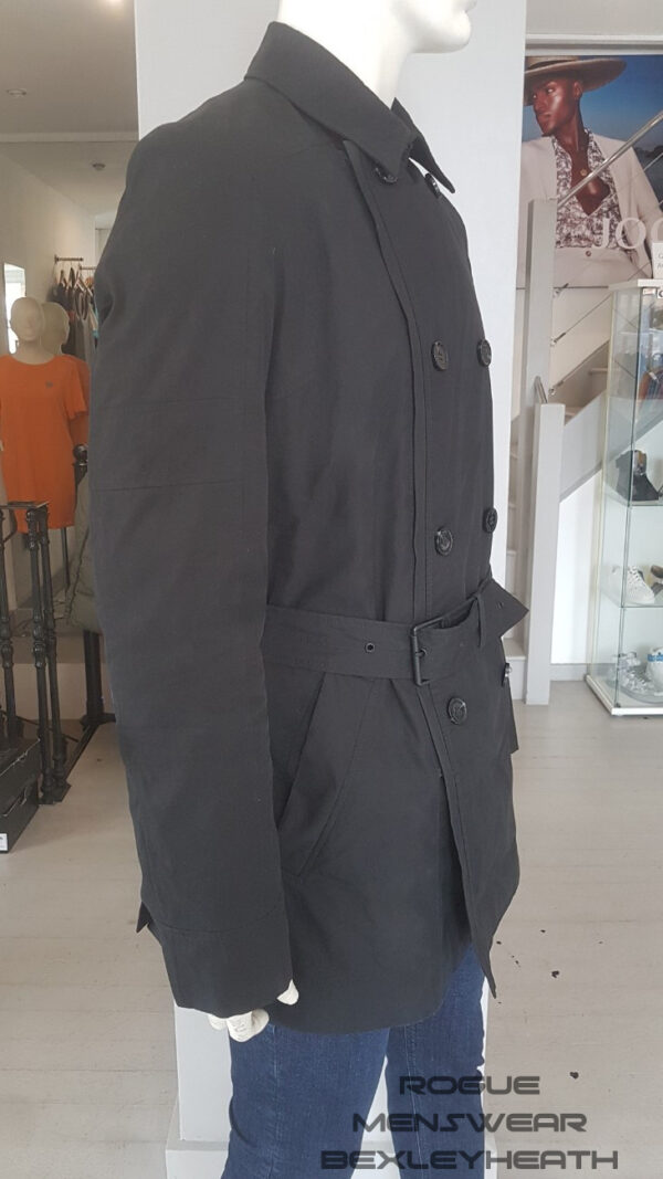 Stylish pre-loved black Hugo Boss trench coat, a timeless piece for the fashion-forward individual